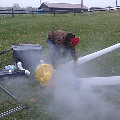 Large outdoor fog setup involving smoke sausages